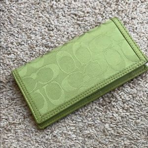 Coach checkbook cover.